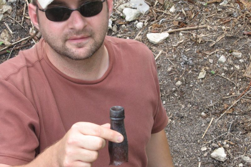 John Gust with an historical bottle neck (most likely Rum).