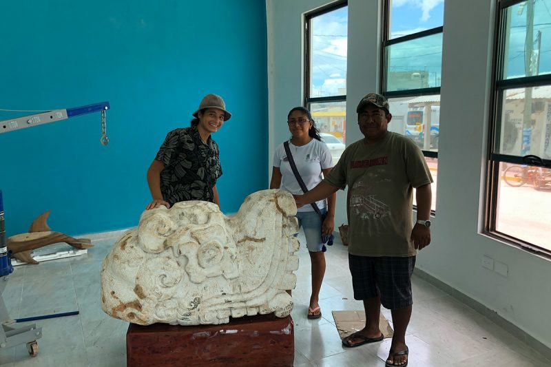 Nathania Martinez and Reymundo Joya posing with the replica serpent head placed in Chiquila.